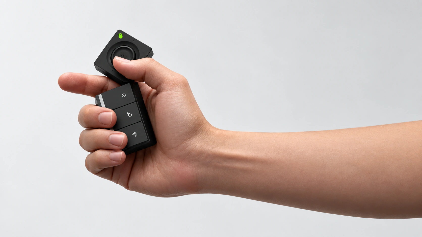 An arm extending from the right holding the black SlashVibe controller against a light gray background.
